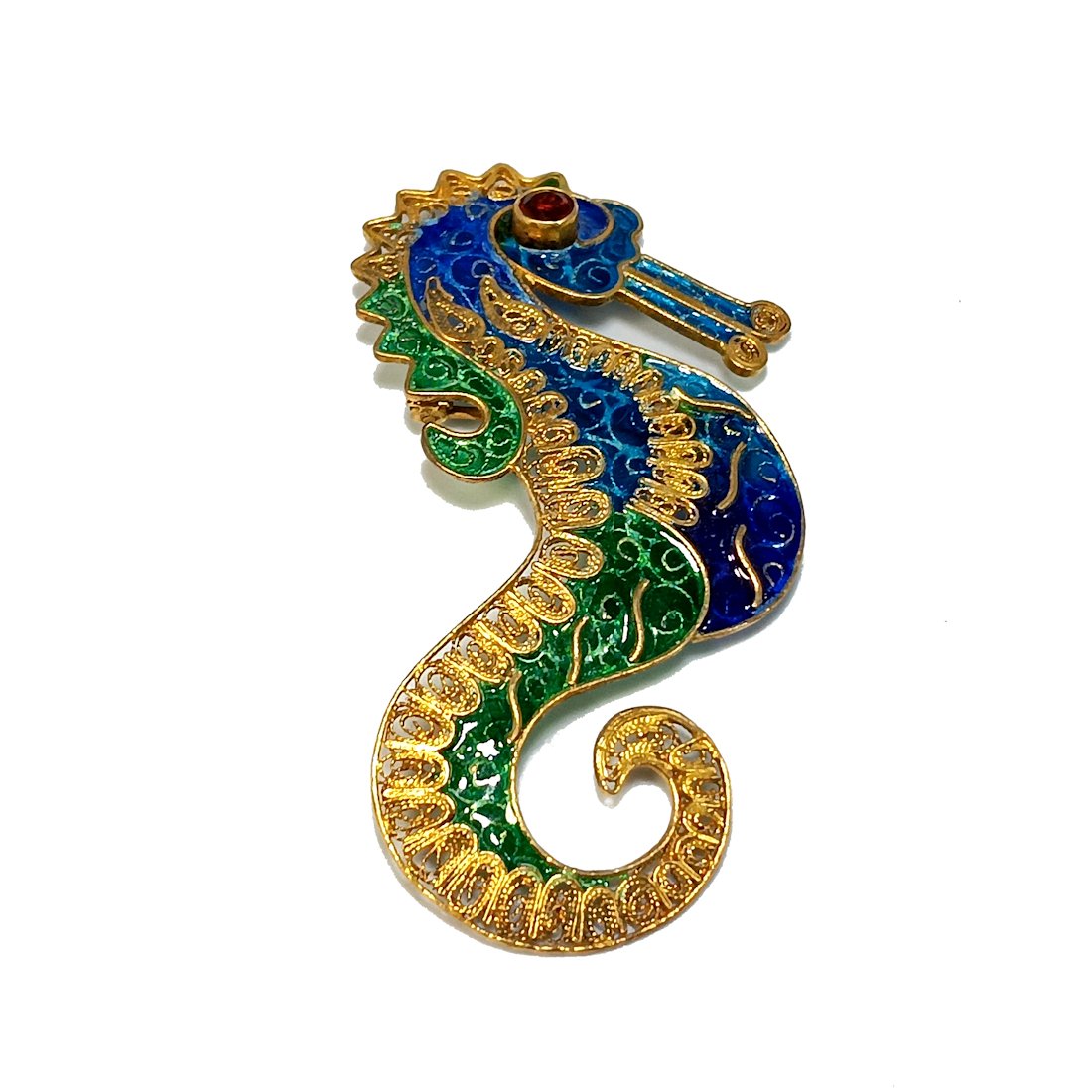 A LARGE PLIQUE-A-JOUR ENAMEL SEAHORSE BROOCH STERLING GARNET: THE SEAHORSE BROOCH IS SET IN GILT STERLING SILVER. IT IS MARKED 925 GB. IT HAS A GARNET EYE (TESTED WITH PRESIDIUM GEM TESTER). IT MEASURES 2.4". IT WEIGHS 6.5 GRAMS. THE PLIQUE-A-JOUR ENAMELING IS A