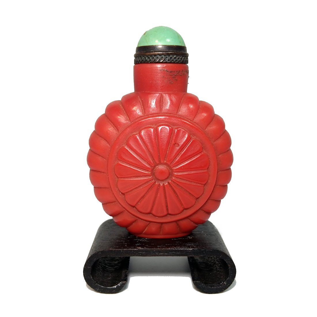 CHINESE PEKING GLASS SNUFF BOTTLE UNIQUE SHAPE: THE BEAUTIFUL CARVED CHINESE SNUFF BOTTLE IN DEEP RED GLASS (DEEPER THAN PICTURED) IT BEARS A TURQUOISE STOPPER. THE BOTTLE IS 2.75 INCHES TALL. STANDS ARE FOR DISPLAY ONLY, NOT INCLUDED UNLESS OTHERW