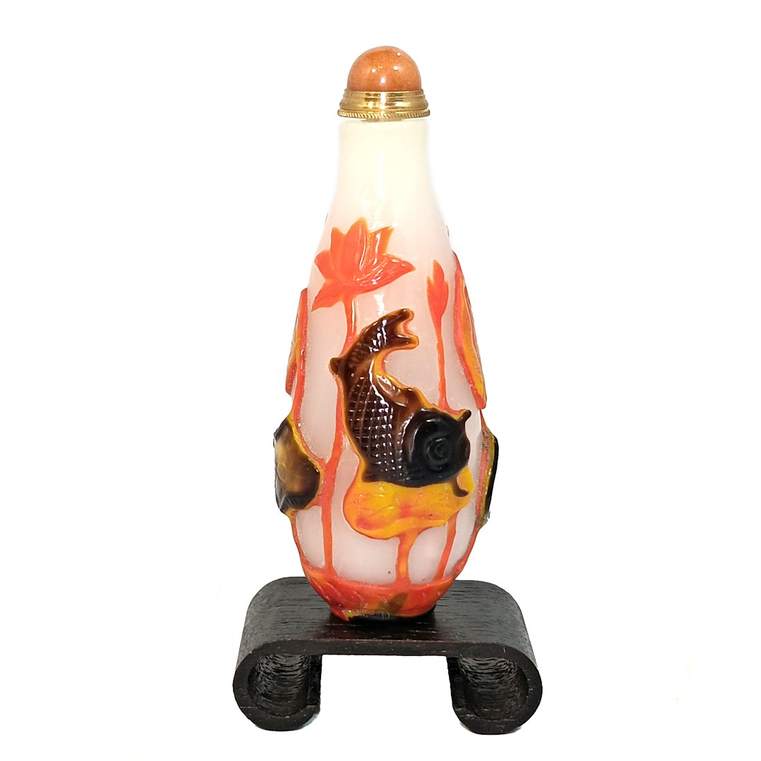 FINE CARVED CHINESE PEKING GLASS SNUFF BOTTLE KOI LOTUS: THIS IS A SUPERB CHINESE SNUFF BOTTLE CARVED IN FOUR LAYERS OF GLASS. IT DEPICTS KOI FISH AND LOTUS ON A MILK GLASS BACKGROUND. THE BOTTLE IS 3.5 INCHES TALL. PROVENANCE: A PRIVATE COLLECTION,FLORIDA.