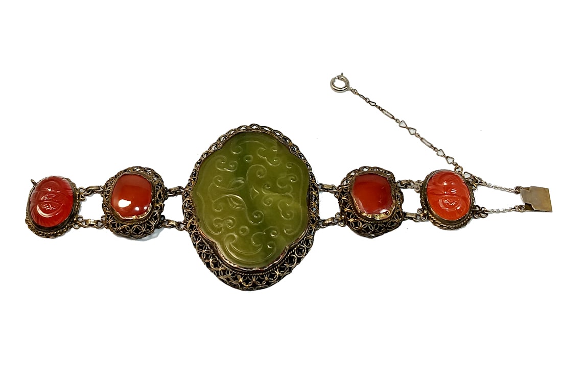 AN EXQUISITE CARVED JADE CARNELIAN BRACELET ANTIQUE CHINESE EXPORT 19TH CENTURY: OFFERED HERE IS A LARGE AND EXQUISITE CARVED JADE CARNELIAN BRACELET ANTIQUE CHINESE EXPORT 19TH CENTURY. IT IS 6.75" LONG AND IT WEIGHS 58.5 GRAMS. THE CENTERPIECE IS 2.5 INCHES WIDE. IT IS SET IN SI