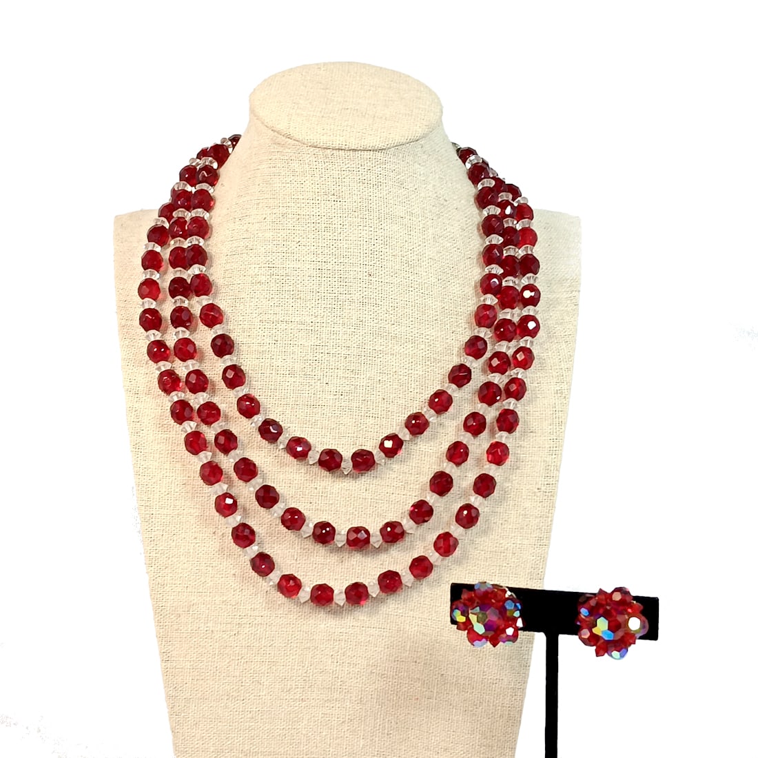 A GORGEOUS VINTAGE NECKLACE AND EARRINGS RED AND CLEAR CRYSTALS: OFFERED HERE IS A RED AND CLEAR CRYSTAL VINTAGE MID-CENTURY NECKLACE. WE HAVE ADDED RED CRYSTAL EARRINGS. THE NECKLACE MEASURES 16" WITH THE EXTENDER. HAVE A LOOK AT OUR MANY VINTAGE JEWELRY LISTINGS.
