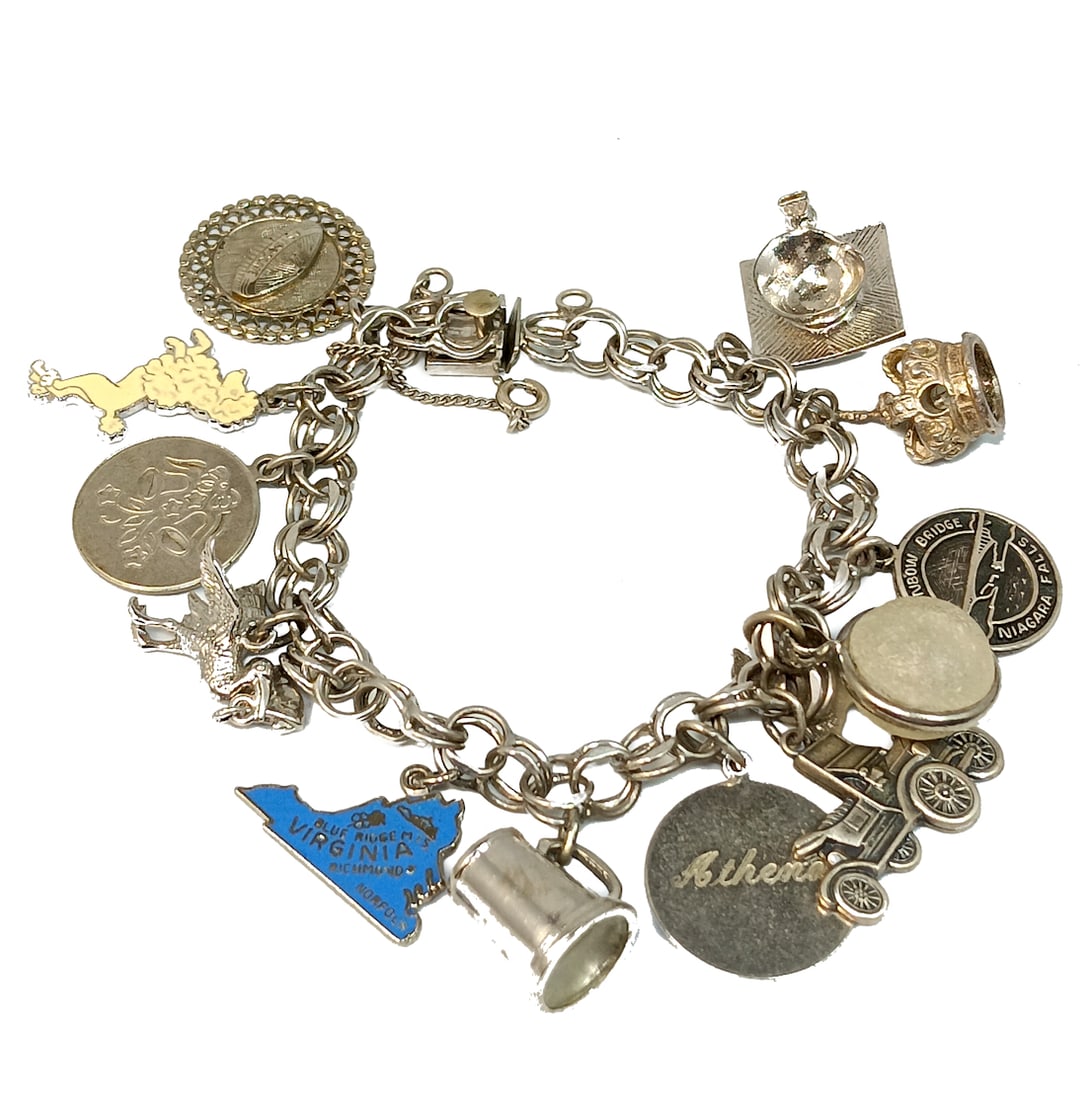 A VINTAGE STERLING CHARM BRACELET 12 CHARMS 41 GRAMS 7.25" (1 of 5)