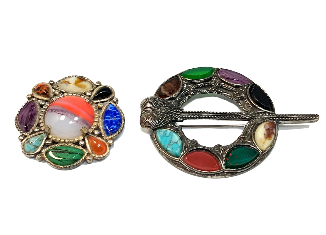 TWO BEAUTIFUL VINTAGE SCOTTISH BROOCHES SIGNED MIRACLE: OFFRED HERE ARE TWO BEAUTIFUL VINTAGE SCOTTISH BROOCHES SIGNED MIRACLE, 3" LONG AND 1.75" IN DIAMETER RESPECTIVELY. WE OFFER IN-HOUSE/COMBINED SHIPPING FOR A SMOOTH AND SEAMLESS CHECKOUT. CHECK OUT OU