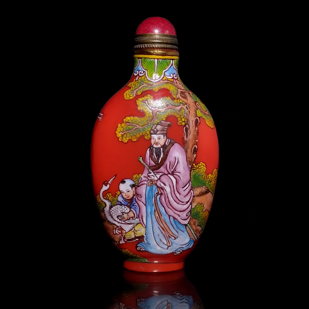 CHINESE ENAMEL PEKING GLASS SNUFF BOTTLE IMMORTALS QIANLONG MARK: THE BEAUTIFUL CHINESE SNUFF BOTTLE FEATURES SCENES OF IMMORTALS WITH CHILDREN AND MANY ADDITIONAL DETAILS. THE BACKGROUND IS RED GLASS. THE BOTTLE BEARS A QIANLONG DATE MARK. IT IS 3.4" TALL.STANDS AR