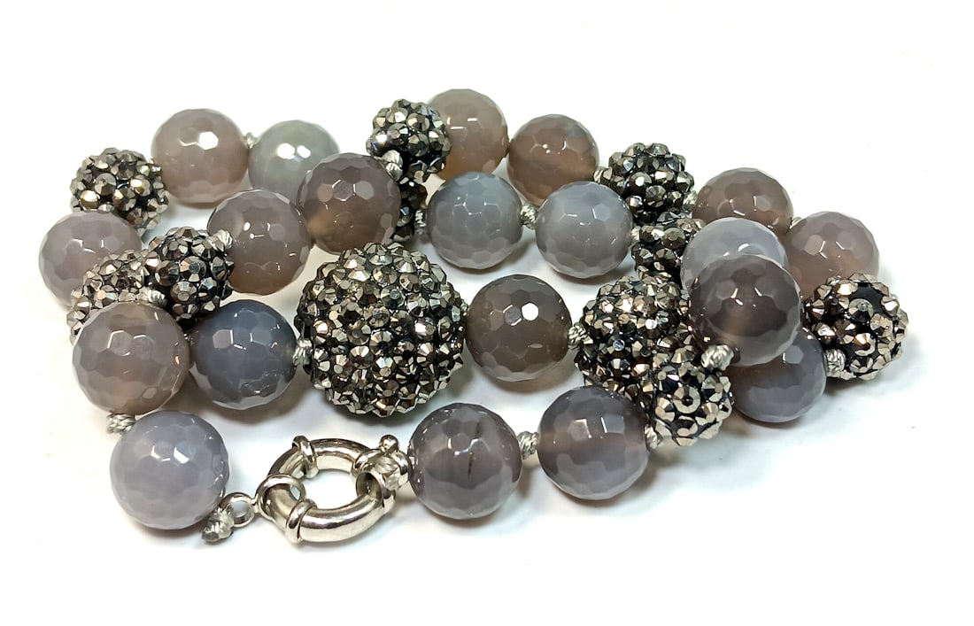 A FABULOUS NECKLACE 12MM FACETED CHALCEDONY AGATE AND MARCASITES: OFFERED HERE IS A FABULOUS NECKLACE OF LARGE 12MM FACETED CHALCEDONY AGATE BEADS AND MARCASITE COVERED BALLS GRADUATING UP TO 22 MM AT THE CENTER. THE STUNNING NECKLACE IS 19" LONG. WE PROVIDE IN-HOUS