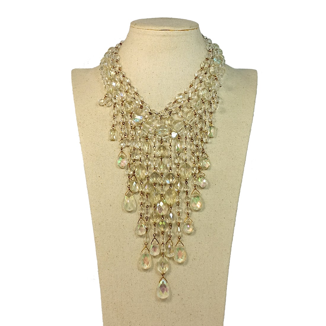 A FABULOUS SIGNED VINTAGE BIB NECKLACE BY JOAN RIVERS: OFFERED HERE IS A FABULOUS SIGNED VINTAGE BIB WITH LONG DANGLES. IT IS SIGNED BY THE DESIGNER JOAN RIVERS. WEARABLE LENGTH IS 17" AND LONGEST DANGLE IS 7". THE BEADS ARE FAUX CRYSTAL LUCITE. THIS IS A