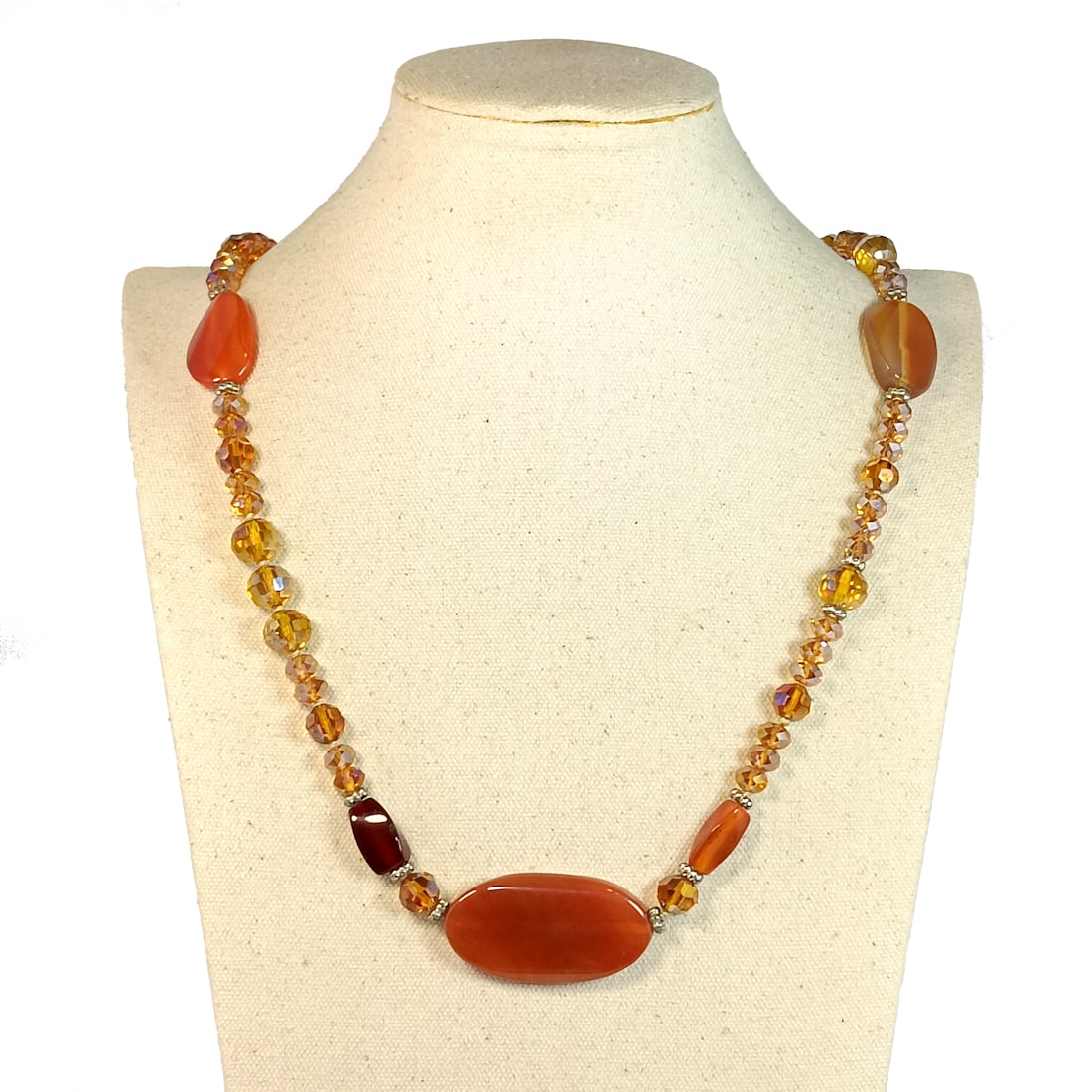 A LARGE AND FABULOUS CARNELIAN AND CRYSTAL NECKLACE 36" LONG: THE CRYSTALS ARE SO BRIGHT AND THE CARNELIAN BEADS COMPLEMENT THEM VERY WELL. THE NECKLACE IS 36" LONG. STANDS ARE FOR DISPLAY ONLY, NOT INCLUDED UNLESS OTHERWISE STATED. WE COMBINE/PROVIDE IN-HOUSE S
