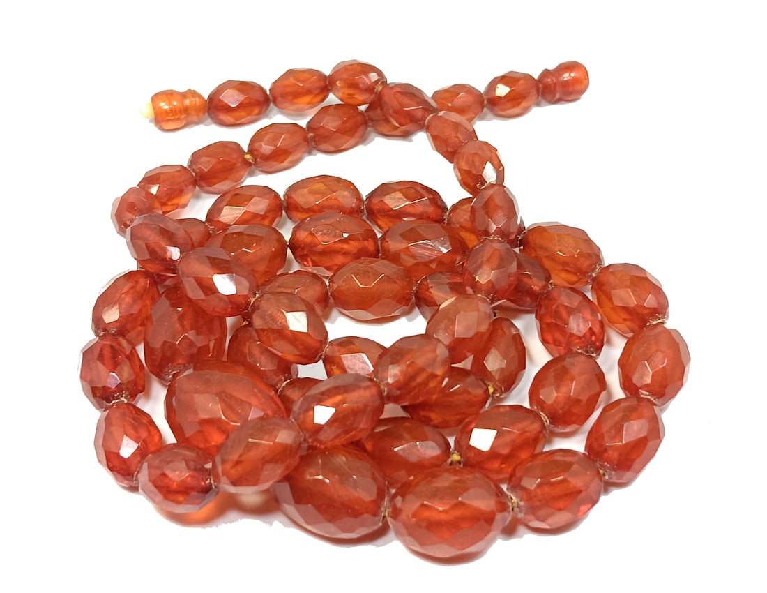 LONG ANTIQUE FACETED GRADUATED BALTIC AMBER NECKLACE 34" AND 54 GRAMS: OFFERED HERE IS A SUPERB, 34" LONG, ANTIQUE FACETED GRADUATED BALTIC AMBER NECKLACE. IT WEIGHS 54 GRAMS. WHAT A TREASURE! ALL OUR AMBER IS TESTED.WE PROVIDE IN-HOUSE/COMBINED SHIPPING FOR YOUR CONVENI