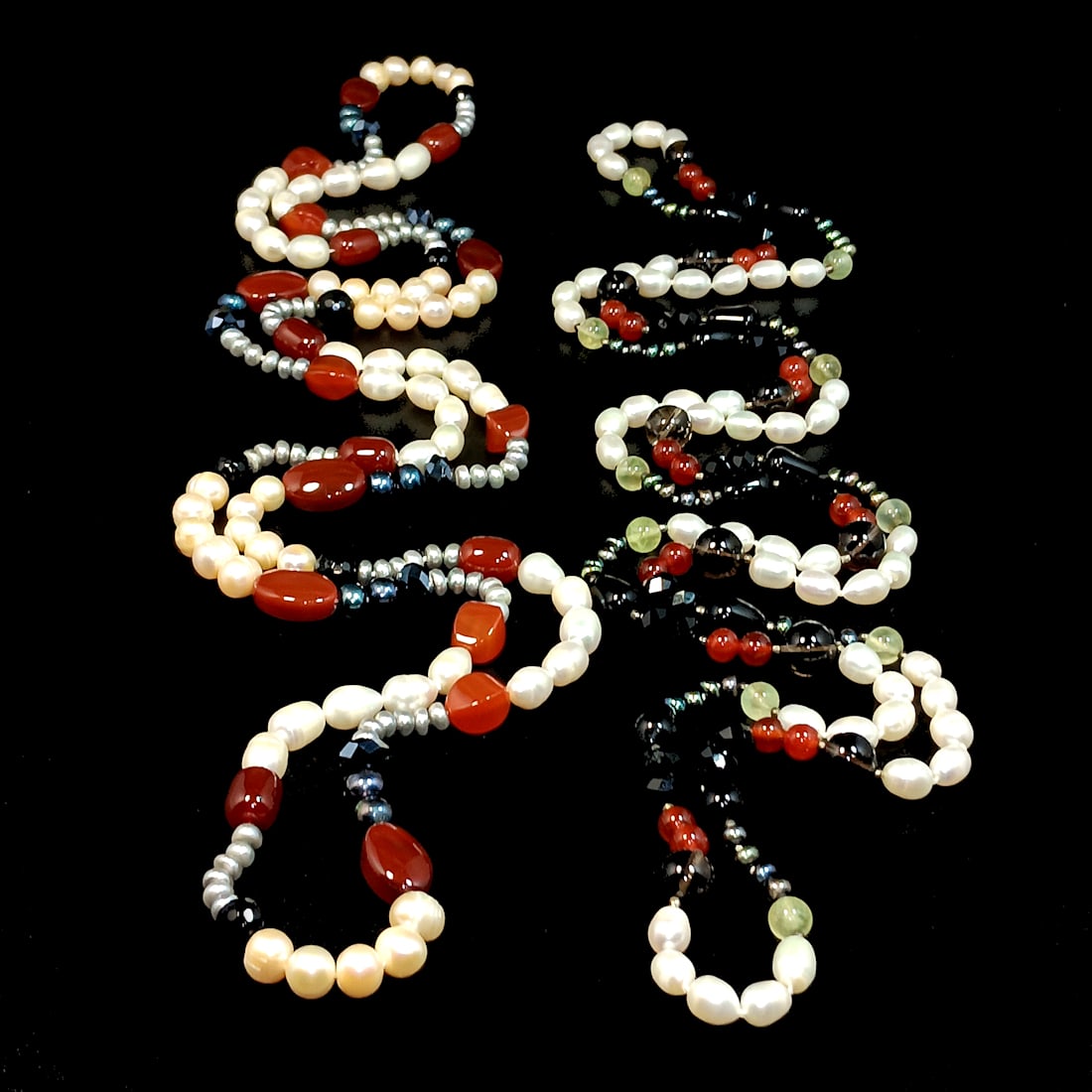 A SET OF TWO LONG 54" &52" PEARL NECKLACES WITH ONYX AND CARNELIAN: OFFERED HERE IS A SET OF TWO LONG 54" &52", LARGE FRESHWATER PEARL NECKLACES WITH ONYX, SMOKEY QUARTZ AND CARNELIAN. WHAT A BEAUTY. WE PROVIDE IN-HOUSE/COMBINED SHIPPING FOR YOUR CONVENIENCE.