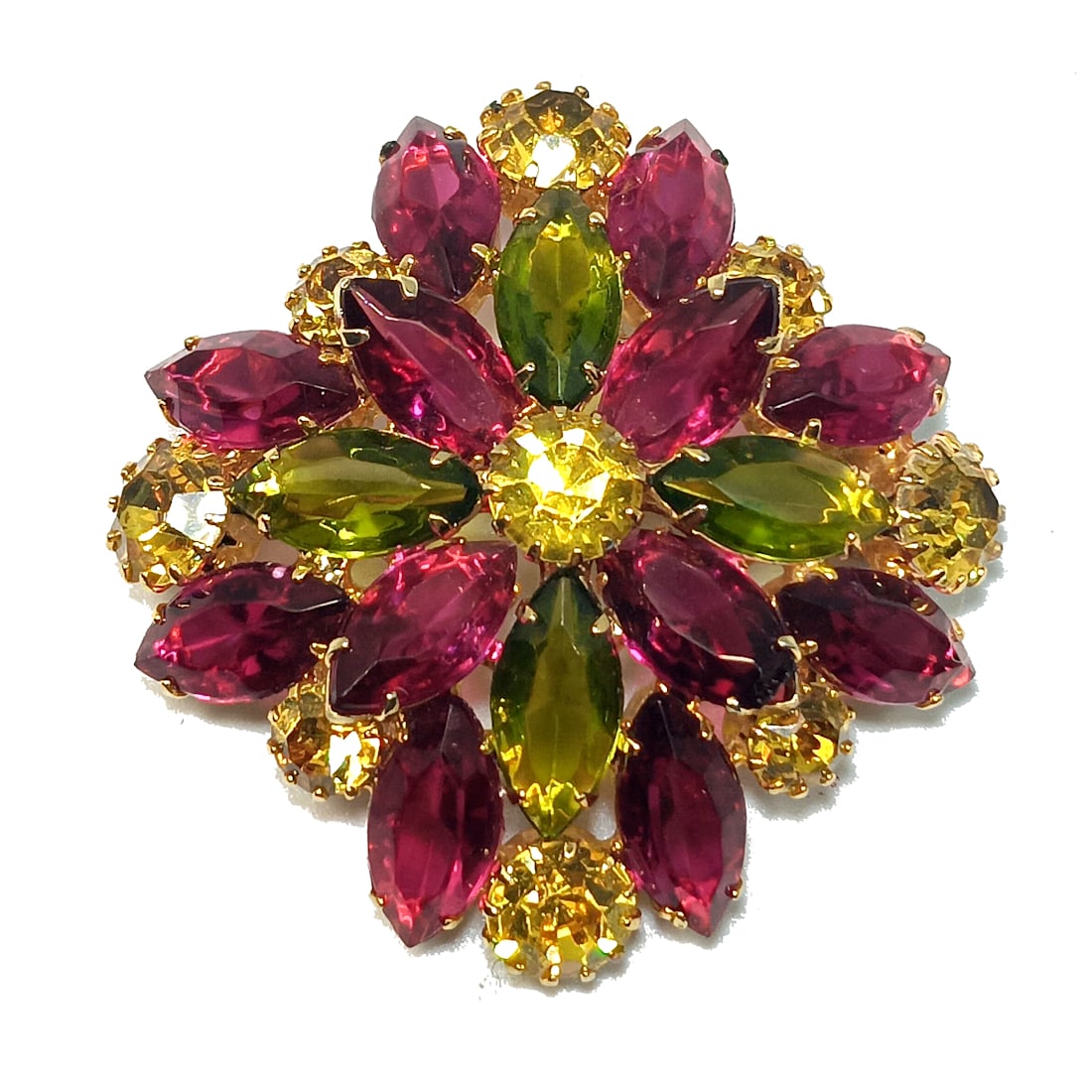 A BRIILLIANT VINTAGE RHINESTONE BROOCH AUSTRIA: OFFERED HERE IS A GORGEOUS VINTAGE RHINESTONE BROOCH , UNSIGNED BDEEP FUSCHIA, CHARTREUSE GREEN AND CITRINE COLORED STONES. MID-CENTURY VINTAGE. GOLD TONE BACKING.WE PROVIDE IN-HOUSE/COMBINED SHIPPING