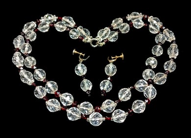 A VINTAGE NECKLACE OF FACETED CRYSTAL AND GARNETS WITH EARRINGS