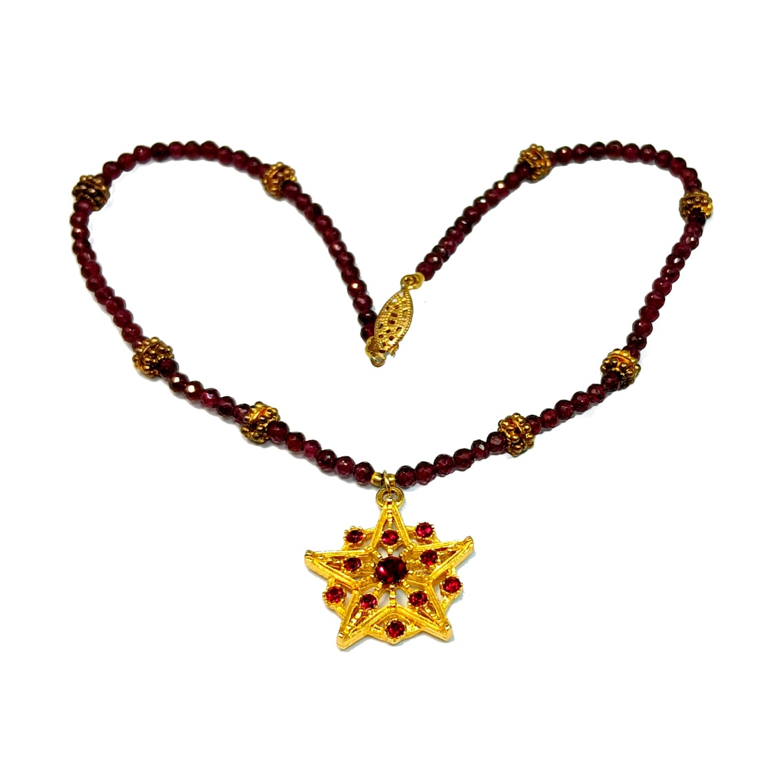 BEAUTIFUL VINTAGE NECKLACE OF FACETED NATURAL GARNETS 16": OFFERED HERE IS A BEAUTIFUL VINTAGE NECKLACE OF FACETED NATURAL GARNETS. THE PENDANT IS STUDDED WITH RED RHINESTONES. WE TEST ALL OUR STONES WITH THE PRESIDIUM GEM-TESTER. THE NECKLACE IS 16"LONG.WE C