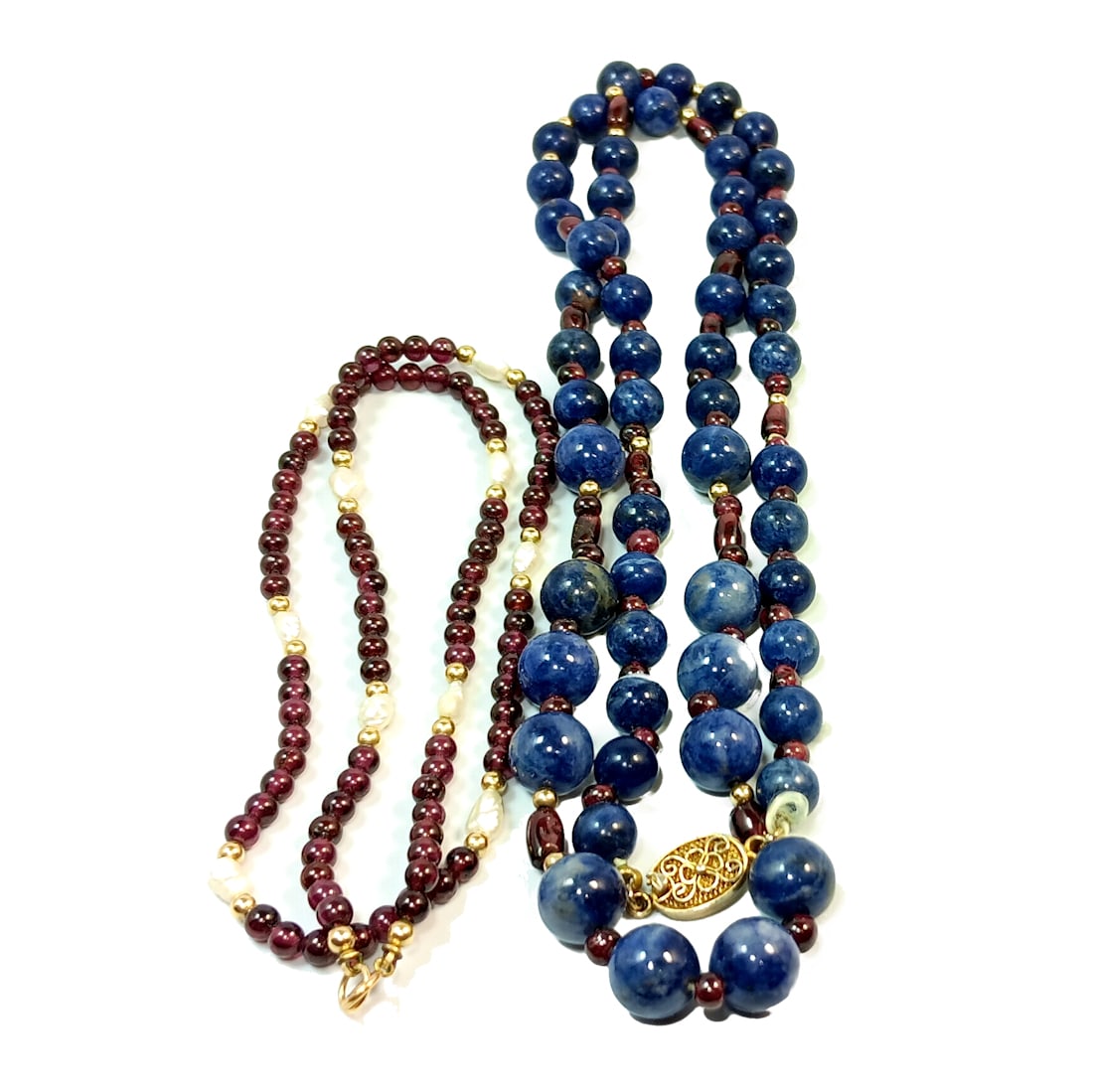 A LOT OF TWO NECKLACES GARNETS AND LAPIS LAZULI: OFFERED HERE IS A LOT OF TWO NECKLACES OF GARNETS AND LAPIS LAZULI. THE WEARABLE LENGTH OF THE LAPIS AND GARNET NECKLACE IS 29". THE GARNET AND PEARL NECKLACE IS 18" LONG. WE OFFER IN-HOUSE/COMBINED S