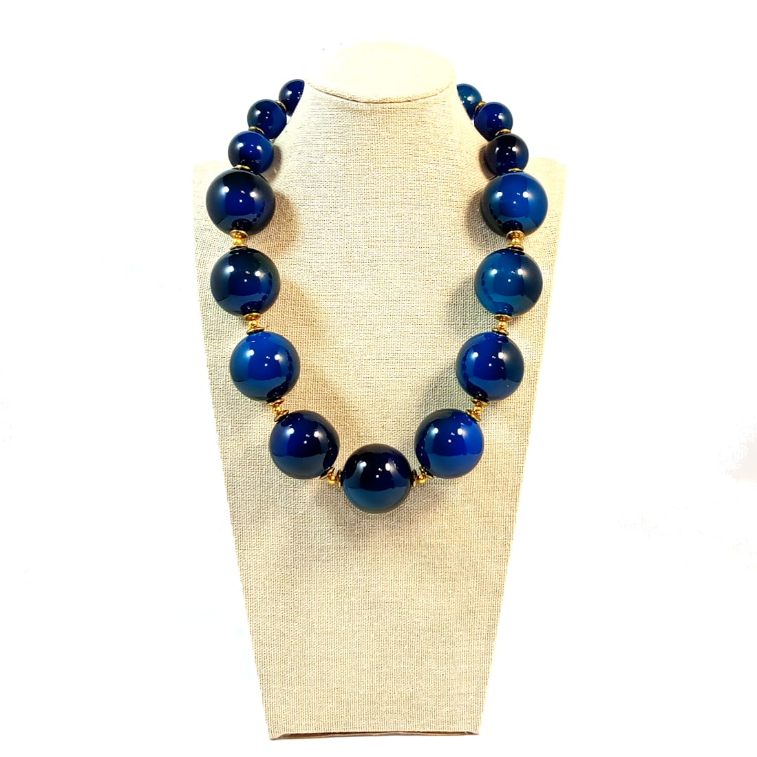 AN IMPRESSIVE VINTAGE STATEMENT NECKLACE BLUE LUCITE 20": FEATURED HERE IS AN IMPRESSIVE VINTAGE STATEMENT NECKLACE IN HUGE BLUE LUCITE BEADS. WE BELIEVE IT MIGHT BE FRENCH OR ITALIAN. THE NECKLACE IS 16" LONG PLUS A 4" EXTENSION. WE PROVIDE/COMBINE IN-HOUSE