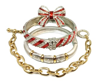 A LOT OF THREE STYLISH BRACELETS AND A BROOCH