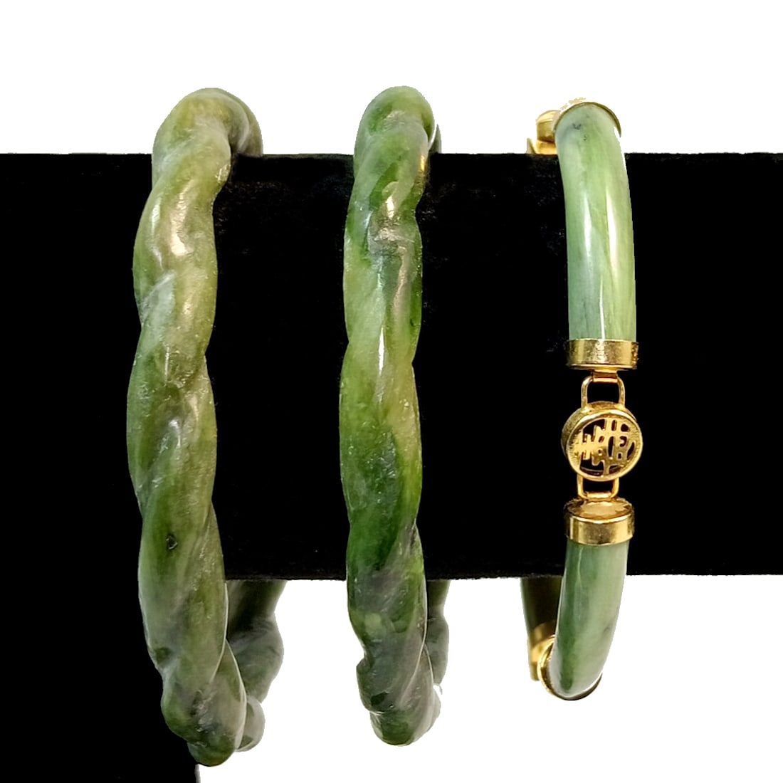 A LOT OF 3 SUPERB CARVED NEPHRITE JADE BRACELETS: OFFERED HERE IS A LOT OF 3 CARVED NEPHRITE JADE BRACELETS. THE INNER DIAMETER OF THE BANGLES IS 2.5". THE BRACELET IS 7" LONG. WE PROVIDE/COMBINE IN-HOUSE SHIPPING.