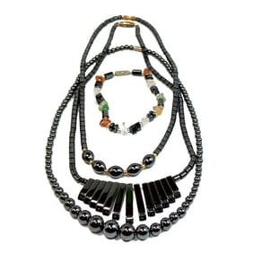 A LOT OF 3 HEMATITE NECKLACES AND A BRACELET