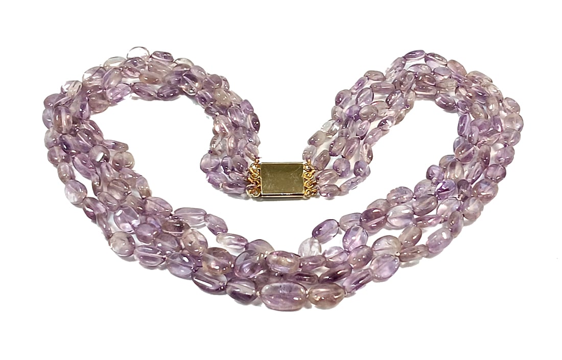 SUPERB VINTAGE AMETHYST NECKLACE 4 STRAND 16.5" 80 GRAMS: OFFERED HERE IS A VINTAGE AMETHYST NECKLACE FEATURING 4 STRANDS OF GRADUATED OVAL AMETHYST BEADS. THE SHORTEST STRAND IS 16.5" LONG. THE NECKLACE WEIGHS 80 GRAMS. SEE PHOTOS FOR COMPLETE DESCRIPTION. 