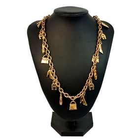 AN IMPRESSIVE LOGO CHARM NECKLACE BY DESIGNER ETIENNE AIGNER 38"