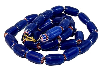 A VINTAGE NECKLACE OF LARGE BLUE WHITE AND RED CHEVRON GLASS BEADS
