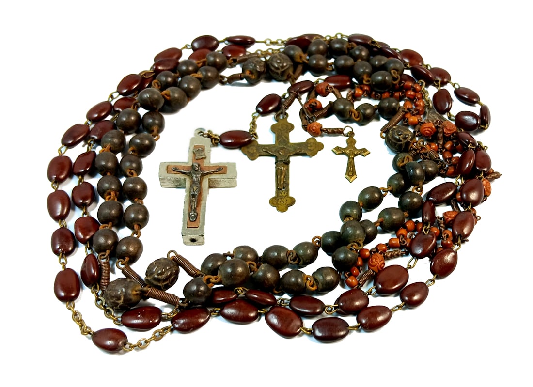 3 OLD ROSARIES OLIVE AND CAROB: OFFERED HERE ARE THREE OLD ROSARIES. ONE IS MADE OF CAROB SEEDS AND IS MARKED ROME ITALY. ONE IS MADE OD OLIVE PITS AND IT IS MARKED SOUVENIR DE LA MISSION. THE SMALL ROSARY SEEMS TO BE MADE OFSOMEKIN