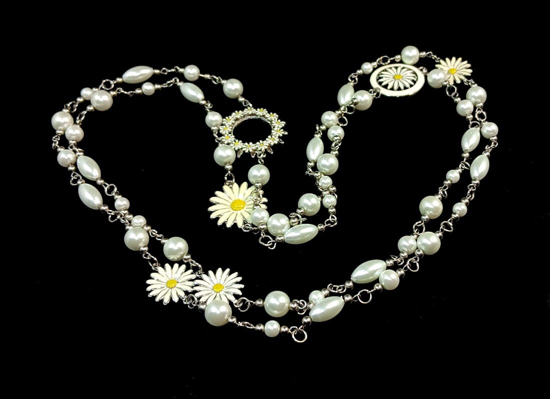 A LONG 56" PEARL NECKLACE ENAMELED DAISIES DESIGN: OFFERED HERE IS A LONG 56" PEARL NECKLACE FEATURING AN ENAMELED DAISIES DESIGN. WE PROVIDE IN-HOUSE/COMBINED SHIPPING FOR YOUR CONVENIENCE.