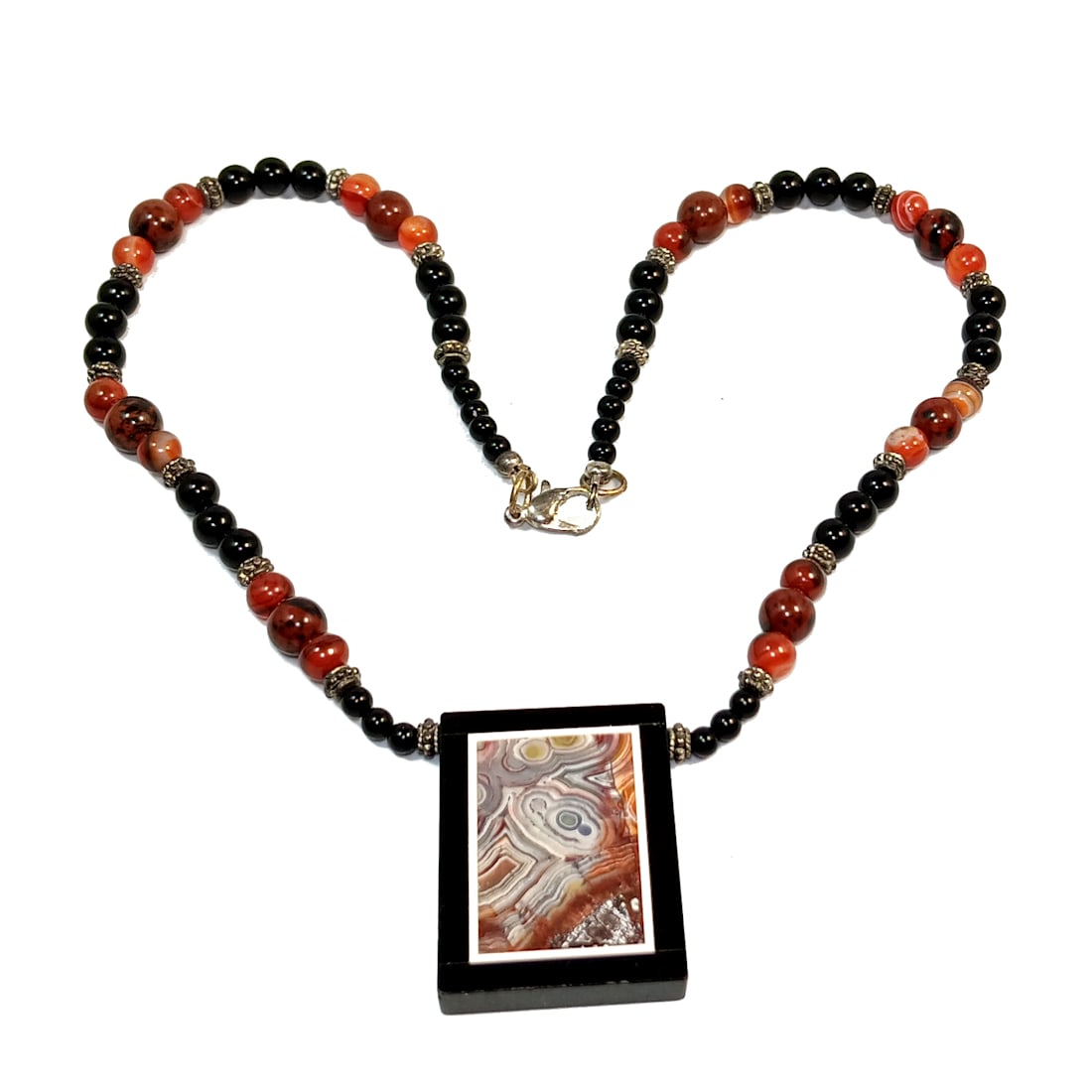 A STUNNING ESTATE NECKLACE ONYX WITH PICTURE AGATE INLAY 17" LONG: OFFERED HERE IS AN ESTATE NECKLACE FEATURING A PENDANT OF ONYX WITH PICTURE AGATE INLAY . THE NECKLACE IS 17" LONG AND IT WEIGHS 42 GRAMS. WE PROVIDE IN-HOUSE SHIPPING. FREE SHIPPING WITHIN THE U.S.