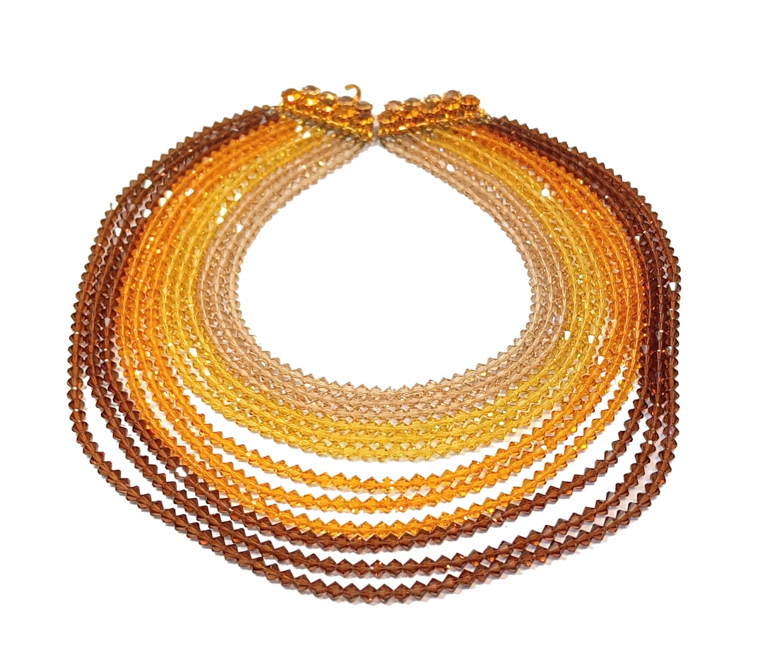 A STUNNING VINTAGE MADE IN AUSTRIA NECKLACE 12 STRANDS OMBRE CRYSTAL BIB: THIS LOT INCLUDES A STUNNING MADE IN AUSTRIA VINTAGE 12 STRANDS NECKLACE OMBRE CRYSTAL BIB. THE SHORT STRAND IS 16", THE LONG STRAND 25". WE PROVIDE IN-HOUSE FREE SHIPPING WITHIN THE US.