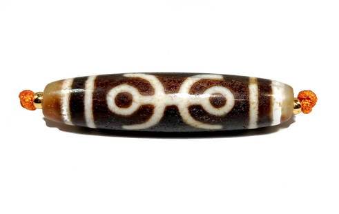 A FINE SINO-TIBETAN AGATE DZI BEAD DOUBLE LONGEVITY PATTERN 55MM: OFFERED HERE IS A FINE SINO-TIBETAN AGATE DZI BEAD FEATURING THE DOUBLE LONGEVITY PATTERN. IT IS 55MM LONG. IT SHOWS SURFACE WEAR AND OXIDATION PATINA. WE PROVIDE IN-HOUSE FREE SHIPPING WITHIN THE US.
