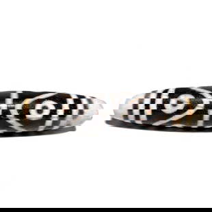 BEAUTIFUL AGATE DZI BEAD 8 EYES PATTERN 57MM: THIS IS A BEAUTIFUL AGATE DZI BEAD. IT FEATURES 8 EYES AND IT IS 57MM LONG. WE PROVIDE IN-HOUSE FREE SHIPPING WITHIN THE US.