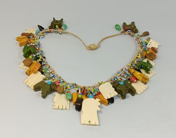 AN IMPRESSIVE AFRICAN BEADED ANIMAL FETISH NECKLACE
