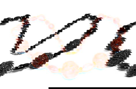 A FINE RARE ANTIQUE CARVED FUTURAN AMBER NECKLACE 80 GR 26": A FINE RARE ANTIQUE CARVED FUTURAN AMBER NECKLACE 80 GRAMS, 26" LONG. THE LARGEST BEAD IS 25MM. PROPERTY OF A FLORIDA COLLECTOR. WE PROVIDE FREE IN-HOUSE SHIPPING WITHIN THE U.S.