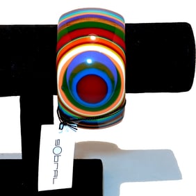 A FABULOUS DESIGNER LUCITE BANGLE BY SOBRAL 2.5" D