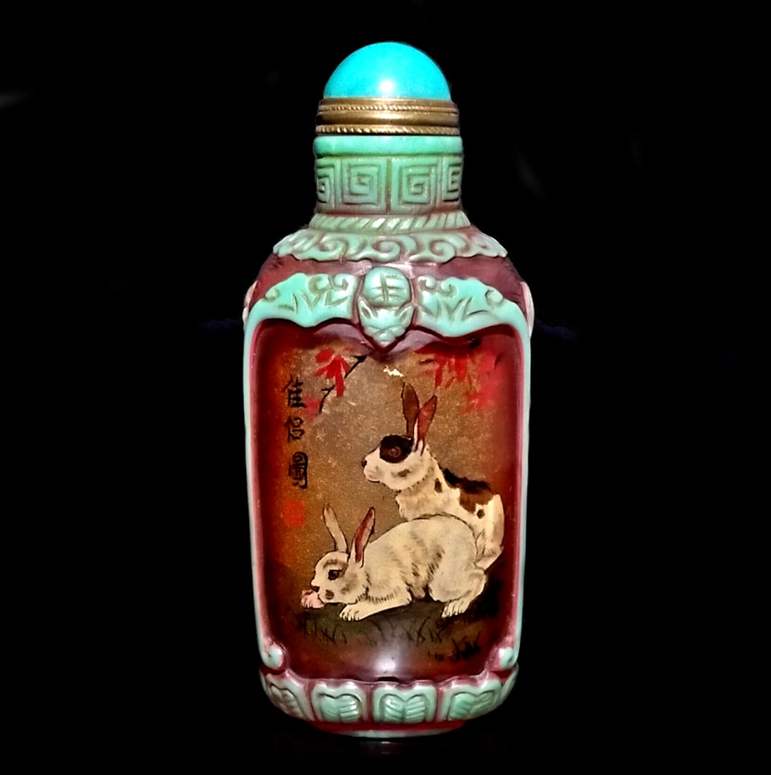 A BEAUTIFUL CHINESE PEKING GLASS INSIDE PAINTED SNUFF BOTTLE RABBITS: THE BEAUTIFUL CHINESE PEKING GLASS SNUFF BOTTLE IS PAINTED ON THE INSIDE WITH RABBITS. IT IS SIGNED BY THE ARTIST. THE BOTTLE IS 3.25 INCHES TALL. STANDS ARE FOR DISPLAY ONLY, NOT INCLUDED UNLESS OTHE