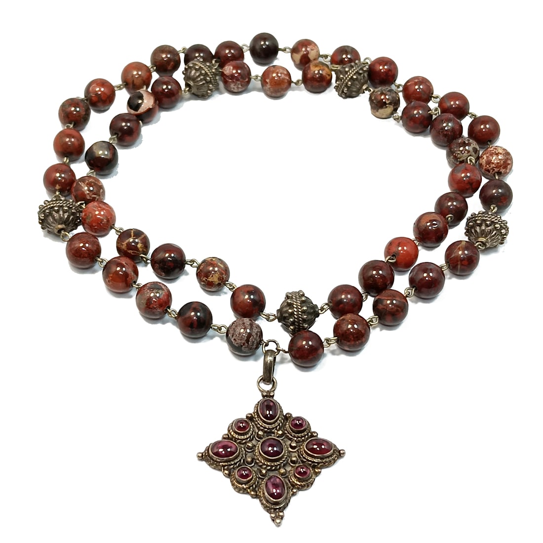 A SUPERB VINTAGE NECKLACE STERLING SILVER GARNETS AND JASPER 30": OFFERED HERE IS A SUPERB VINTAGE NECKLACE STERLING SILVER ENCRUSTED WITH GARNETS AND FEATURING JASPER BEADS. THE NECKLACE IS 30" LONG. THE PENDANT MEASURES 2" LONG BY 1.5" WIDE. THE NECKLACE WEIGHS 10