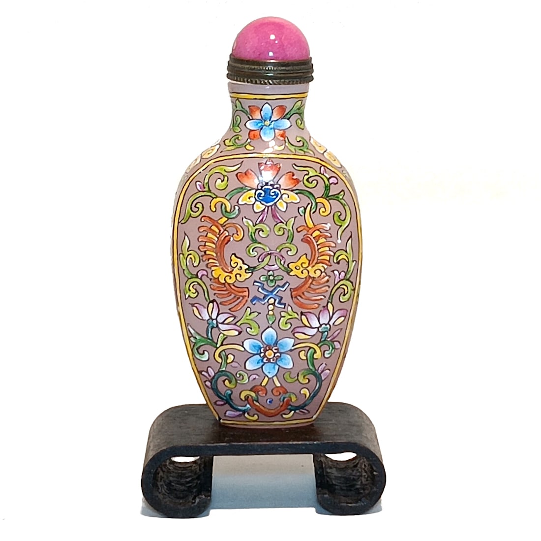 AN EXQUISITE CHINESE PEKING GLASS ENAMELED FLORAL SNUFF BOTTLE QIANLONG MARK: THIS EXQUISITE CHINESE ENAMELED SNUFF BOTTLE IS 3.25" TALL. THE BOTTLE FEATURES FLOWERS ALL AROUND ON A PINK BACKGROUND. STANDS ARE FOR DISPLAY ONLY, NOT INCLUDED UNLESS OTHERWISE STATED. PROPERTY OF 
