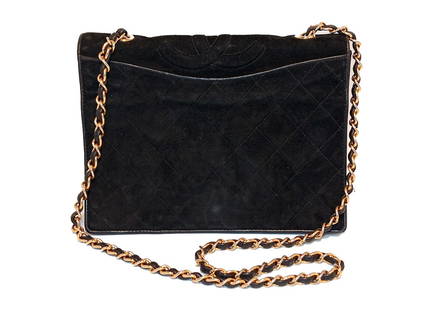 A VINTAGE CLASSIC CHANEL QUILTED MINI FLAP BAG- BLACK LAMBSKIN SERIAL 1148865: THIS LOT COSISTS OF A VINTAGE AUTHENTIC CHANEL CLASSIC MINI FLAP BAG IN LUXURIOUS BLACK LAMBSKIN QUILTED LEATHER. ACCENTED BY GLEAMING GOLD-TONE CHAIN INTERWOVEN WITH LEATHER, THIS ELEGANT SILHOUETTE