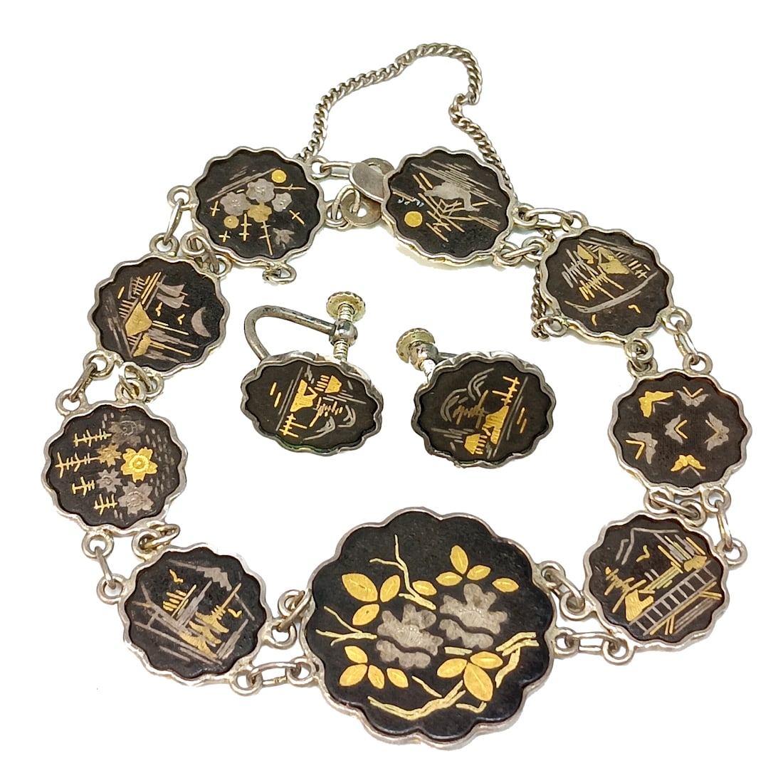 FINE VINTAGE SILVER AMITA JAPAN DAMASCENE BRACELET AND EARRINGS 7": OFFERED HERE IS A FINE VINTAGE JAPANESE AMITA BRACELET IN DAMASCENE WORK. IT IS SET IN SILVER AND MEASURES 7". EARRINGS ARE INCLUDED. WE PROVIDE FREE IN-HOUSE SHIPPING WITHIN THE U.S.