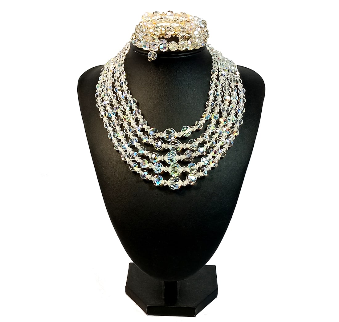 A 5 STRAND VINTAGE CRYSTAL A/B NECKLACE AND TWO BRACELETS: OFFERED HERE ARE A 5 STRAND VINTAGE CRYSTAL AURORA BOREALIS NECKLACE AND TWO BRACELETS. THE NECKLACE IS 15" LONG. WE PROVIDE FREE IN-HOUSE SHIPPING WITHIN THE U.S.
