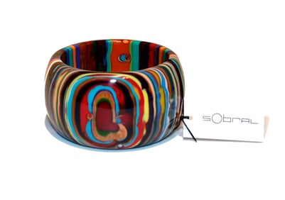 A WONDERFUL DESIGNER LUCITE BANGLE BY SOBRAL 2.5" D
