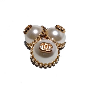 A FINE VINTAGE LOT CHANEL LOGO PEARLIZED BUTTONS SET OF 3