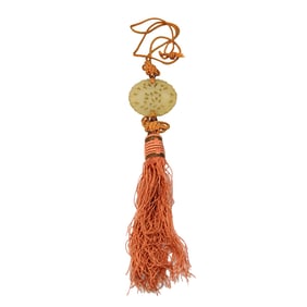 A BEAUTIFUL ANTIQUE JADE PENDANT ON SILK CORD