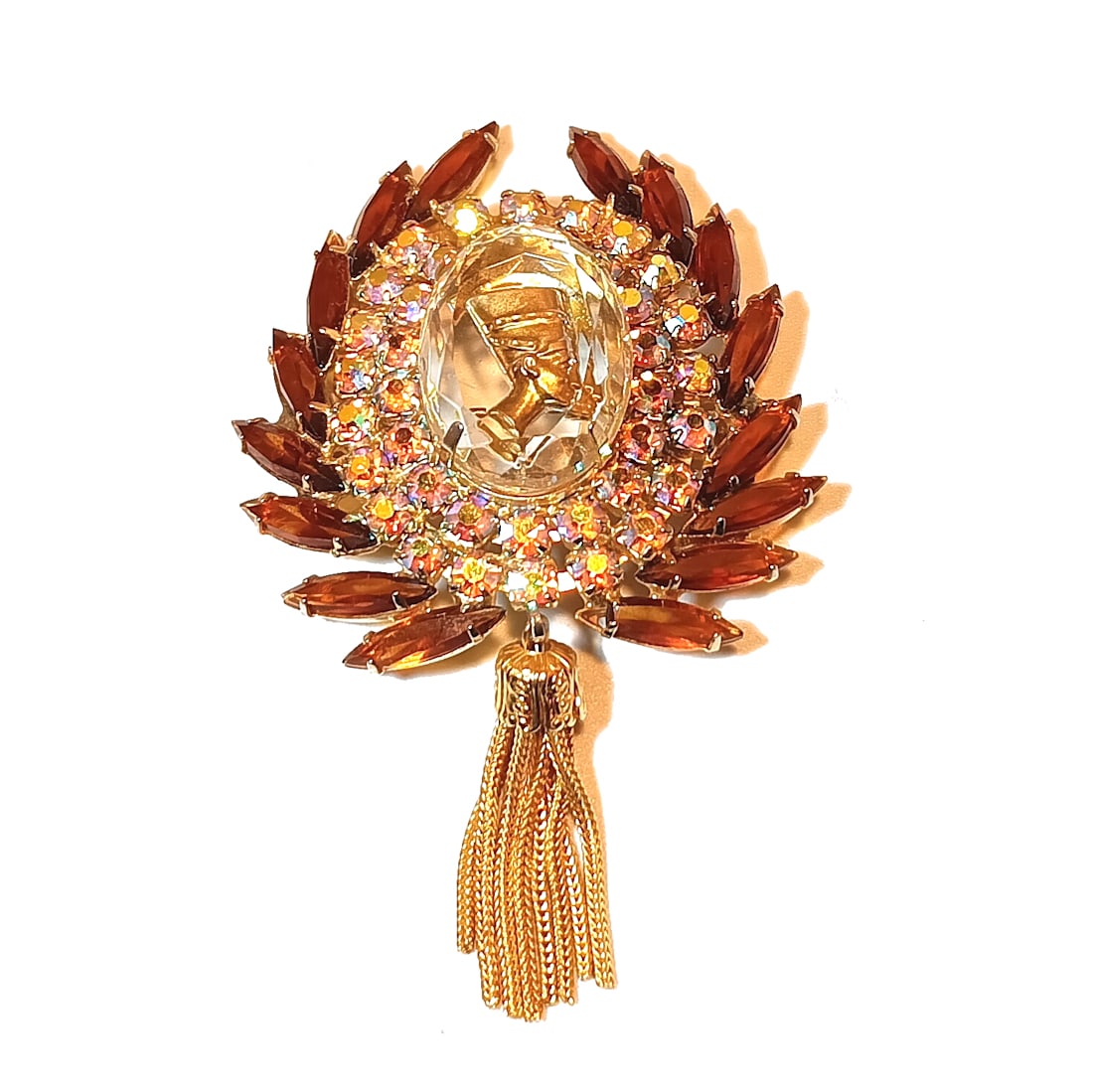 VINTAGE JULIANA D&E BOOK PIECE EGYPTIAN REVIVAL TASSEL BROOCH PENDANT NEFERTITI: THIS LOT INCLUDES A FINE VINTAGE EGYPTIAN REVIVAL TOPAZ AB RHINESTONES JULIANA D&E BROOCH / PENDANT BOOK PIECE. THE BROOCH MEASURES 3.25" BY 2". EXCELLENT CONDITION. WE PROVIDE FREE IN-HOUSESHIPPING W