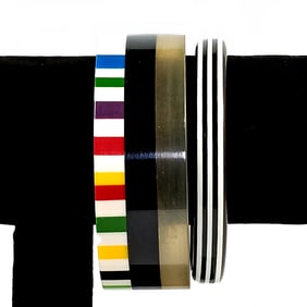 TWO VINTAGE LAMINATED LUCITE BANGLES 2.5" D
