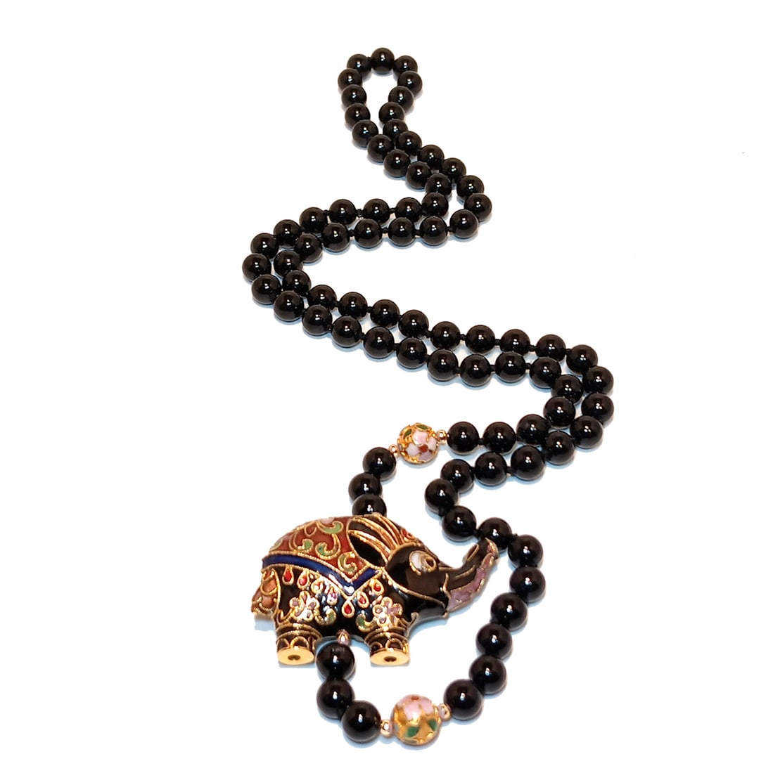 VINTAGE BLACK BEAD NECKLACE WITH CLOISONNE ENAMEL ELEPHANT PENDANT 28": ELEGANT VINTAGE NECKLACE FEATURING POLISHED BLACK BEADS ( GEMSTONE TESTED, TYPE NOT CONFIRMED) ACCENTED WITH COLORFUL CLOISONNE ENAMEL BEADS AND A BEAUTIFULLY DETAILED ELEPHANT PENDANT. TOTAL LENGTH A