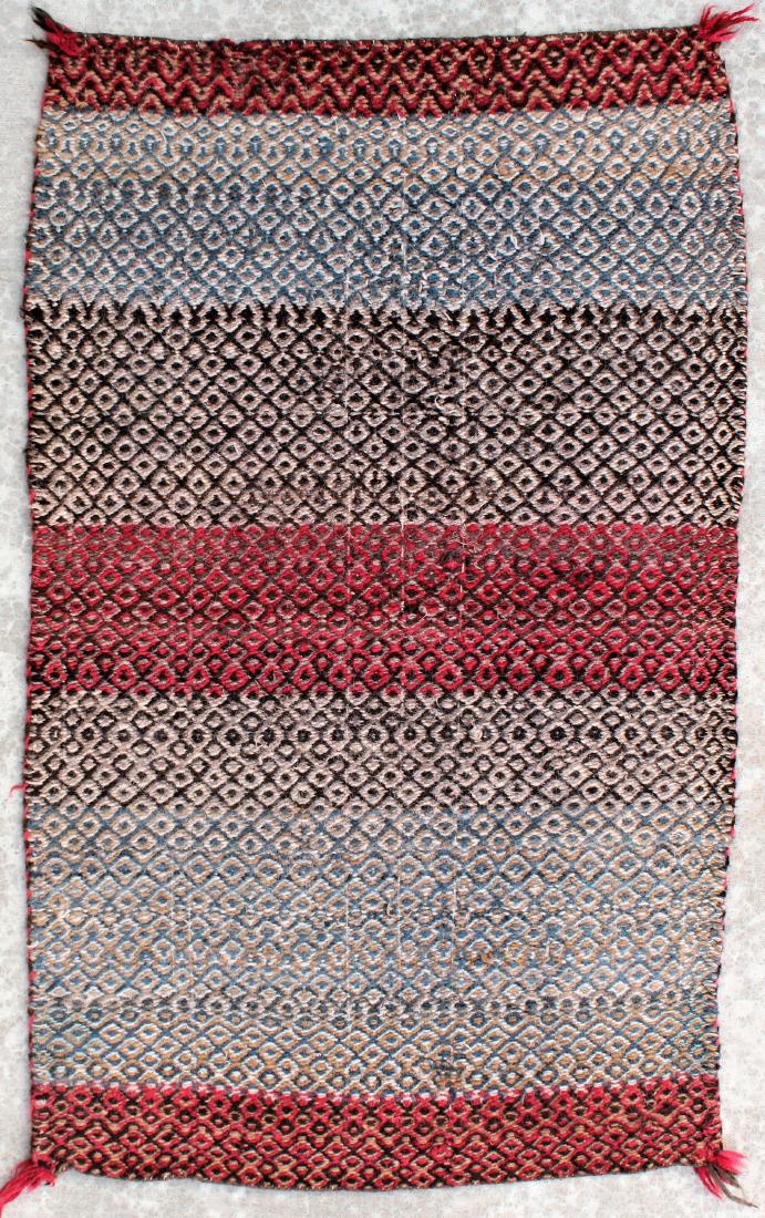 Navajo Blanket: 1900's Transitional double saddle blanket, diamond twill, woven of old long staple Churro sheep wool, and using rare blue dye. Measuring 30"x 50".