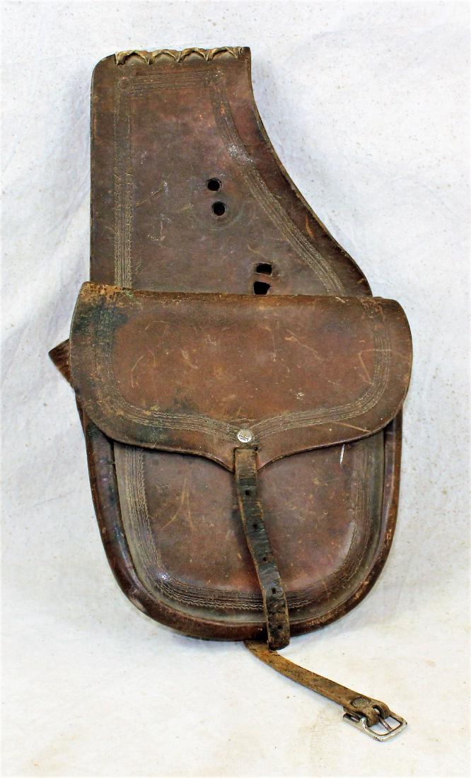 Heiser Saddlebags: Nice pair of saddle pockets with border tooling, original leather lace, and Triple "H" Heiser rivets. Showing light uncleaned color.