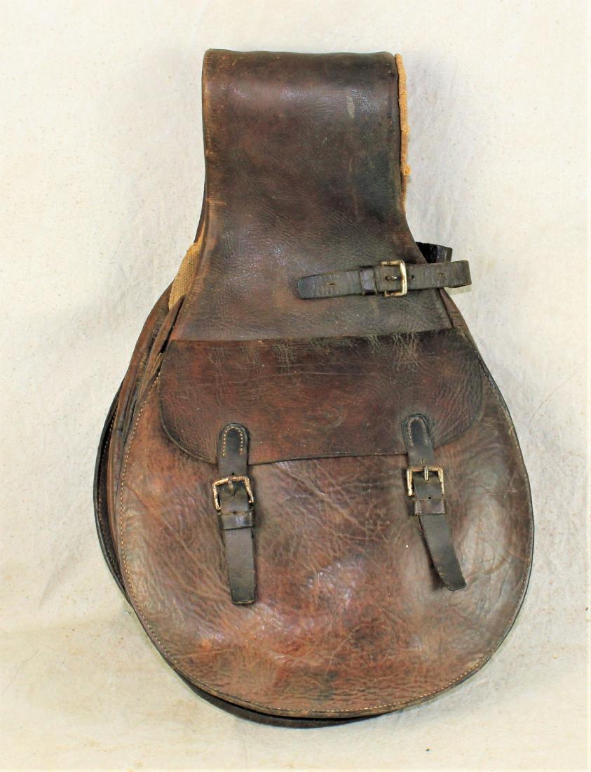 Main and Winchester Saddle Bags: Interesting pair of saddlebags with hidden compartments on the underside, marked with questionable maker's mark, nice large bags with appealing color and condition.