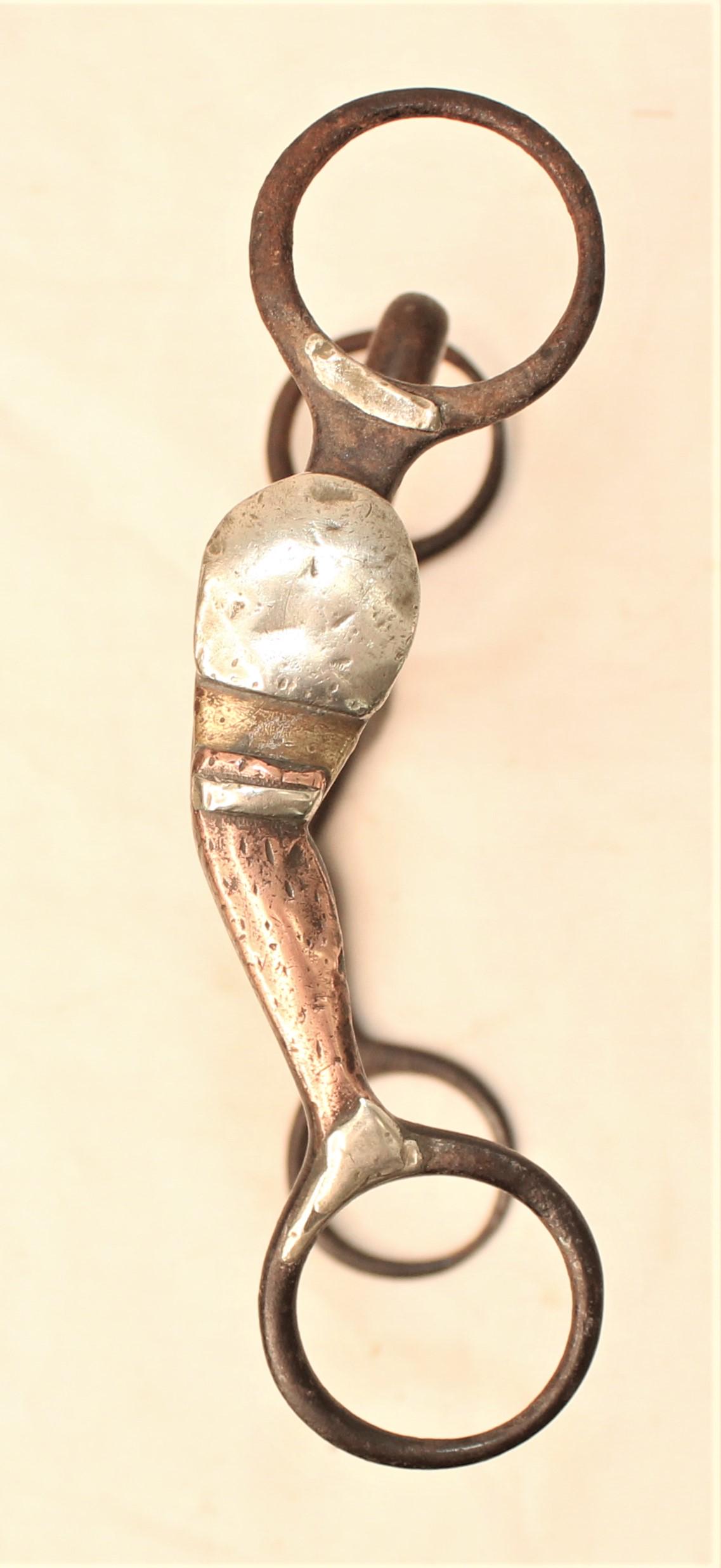 McChesney #4 Gal Leg Bit: Unusual lady leg bit with gold garters and tall pinched mouthpiece.