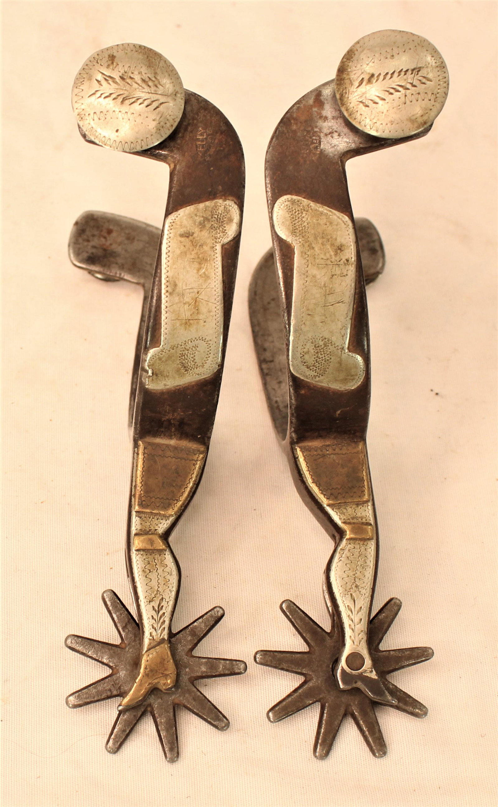 Kelly Bro's Spurs: Widely collected pair of double mounted lady legs spurs with great honest wear and appeal.